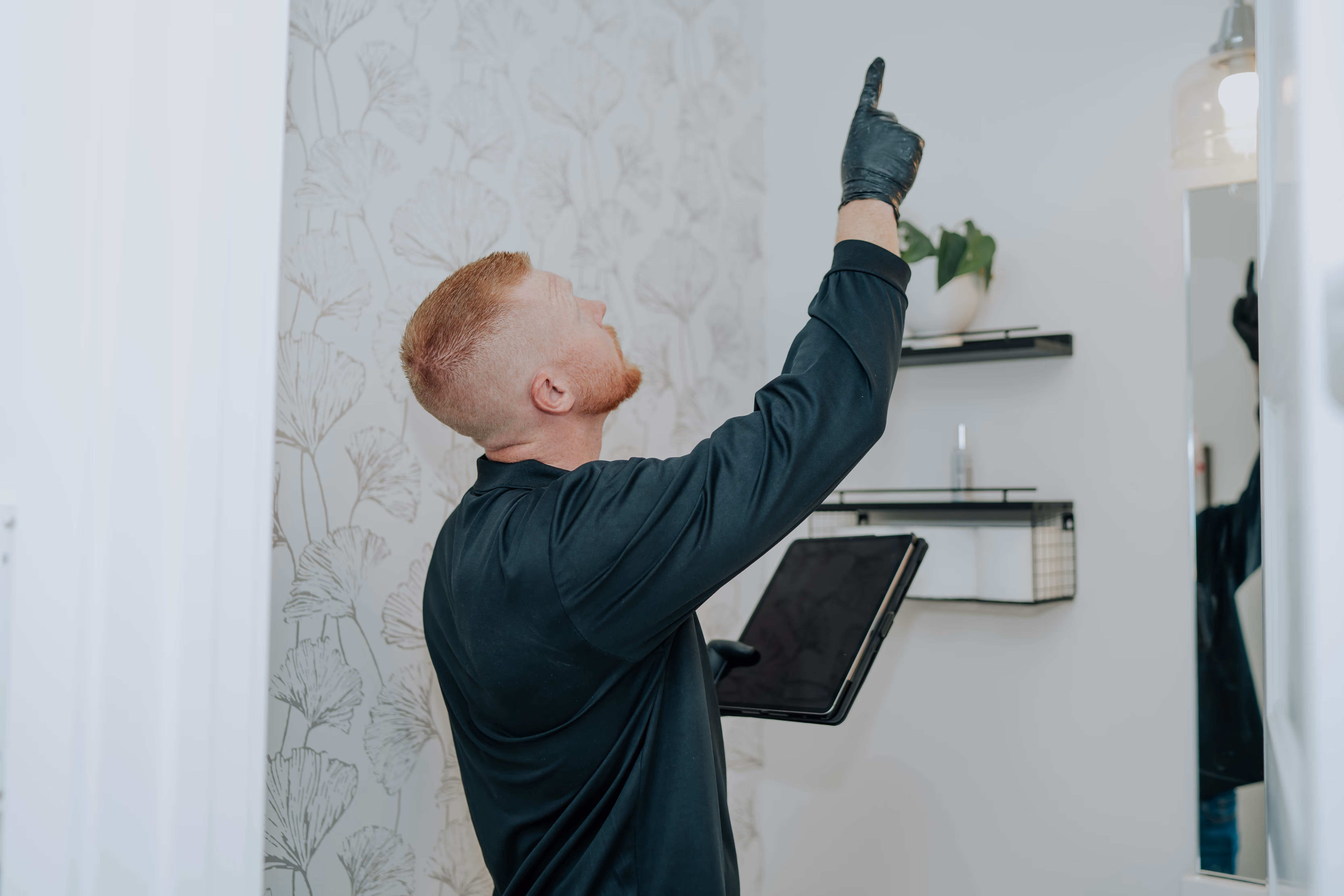 Pure Maintenance of East Texas specialist inspecting a property